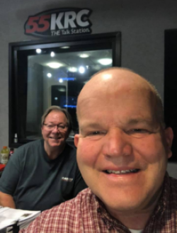 Ron taking selfie with man on radio show